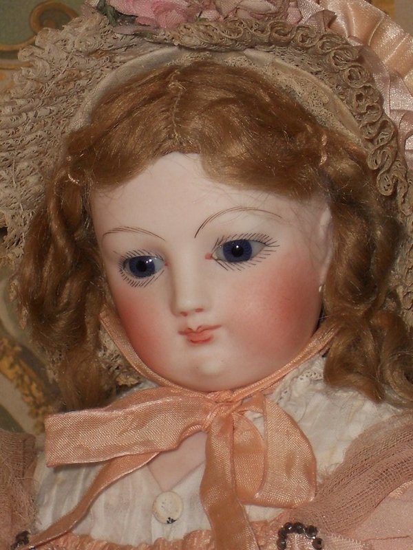 Outstanding French Bisque Poupee with rare Wooden and Kid Body