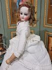 Pretty French All Wooden Body Bisque Poupee with lovely Pique Costume