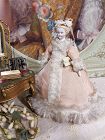 Lovely early Bisque Doll House Mademoiselle in original Silk Gown