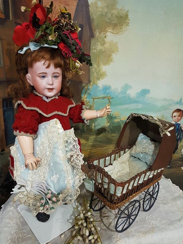 Cute small French 19th. Century Doll Stroller with silk Pillows