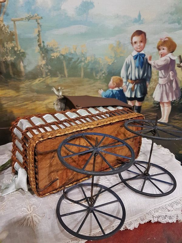 Cute small French 19th. Century Doll Stroller with silk Pillows