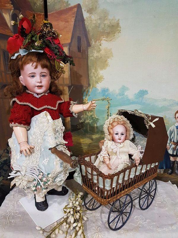 Cute small French 19th. Century Doll Stroller with silk Pillows