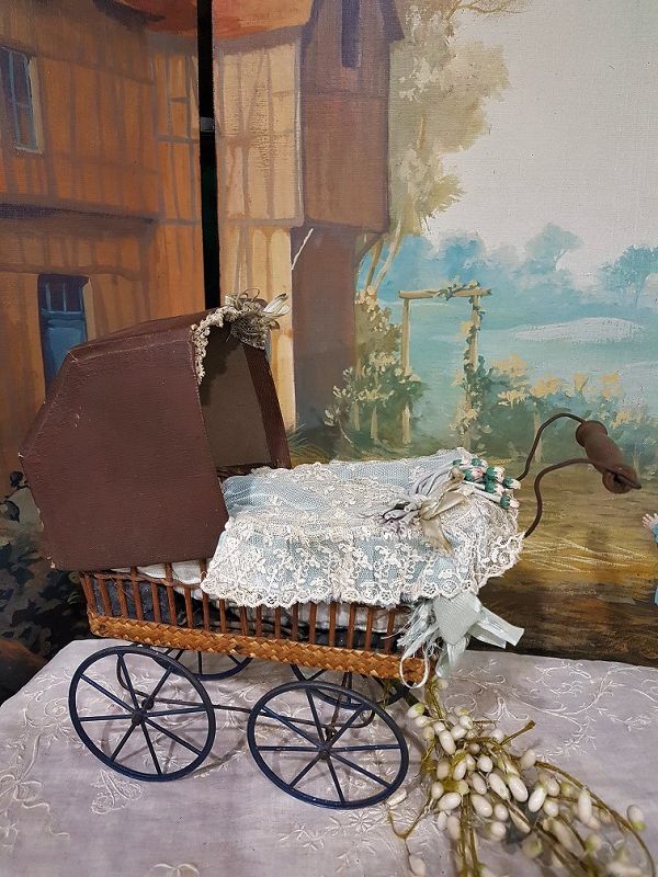 Cute small French 19th. Century Doll Stroller with silk Pillows