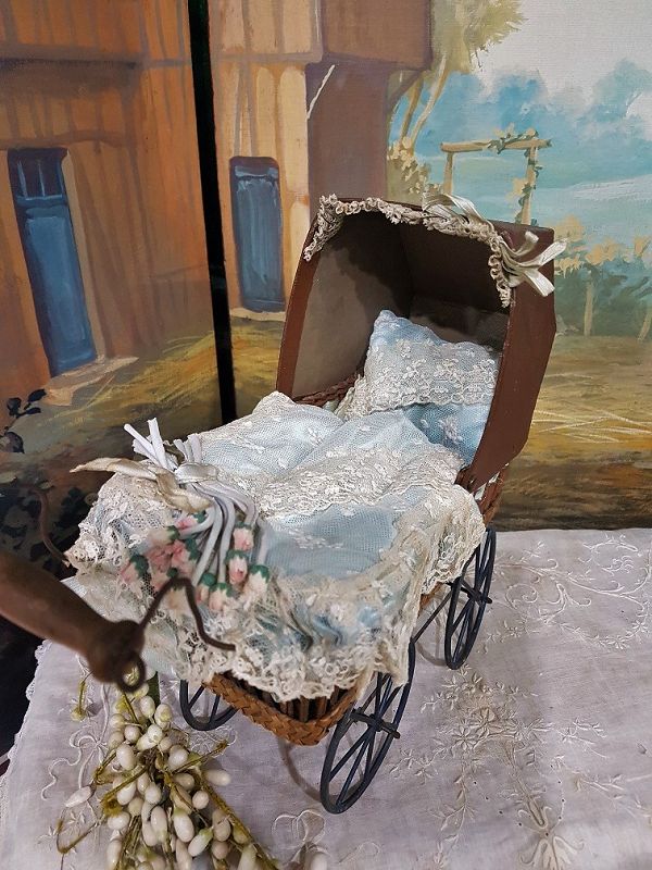 Cute small French 19th. Century Doll Stroller with silk Pillows