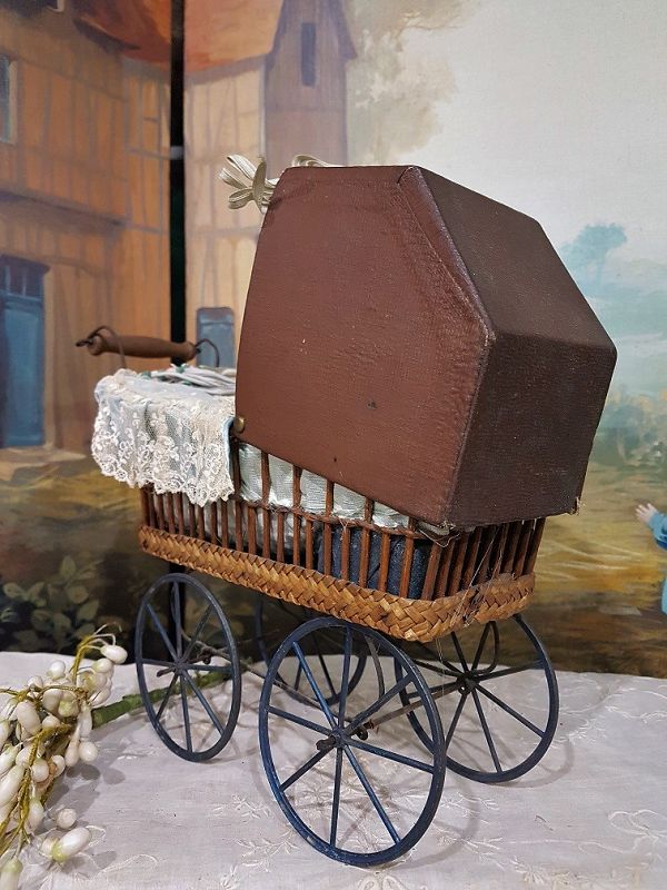Cute small French 19th. Century Doll Stroller with silk Pillows