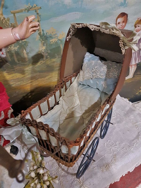 Cute small French 19th. Century Doll Stroller with silk Pillows