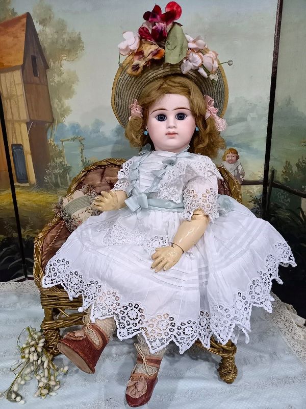 Bisque doll dressed in handmade clothes, 1890-1900