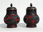 Chinese black over red carved cinnabar lacquer jars