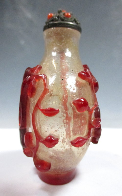 Peking Glass Snuff Bottle With Carvings Of A Man