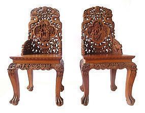 Pair of Chinese Hardwood Chairs with Detailed Carvings