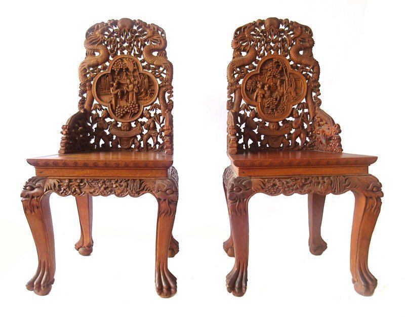 Pair of Chinese Hardwood Chairs with Detailed Carvings