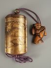 Japanese Gold Lacquer Inro with Mountain Cottage and Boxwood Netsuke