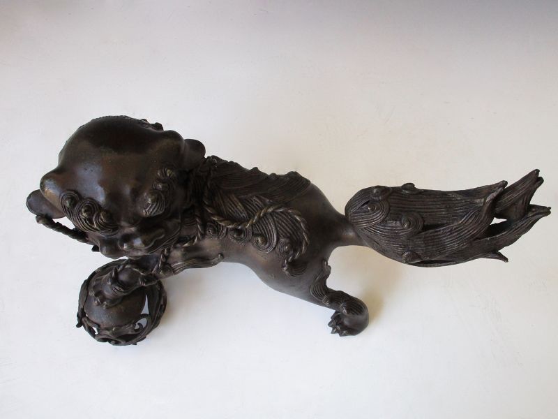 Vintage Japanese Bronze Shishi Fu Dog Holding Scrolling Vine Sphere