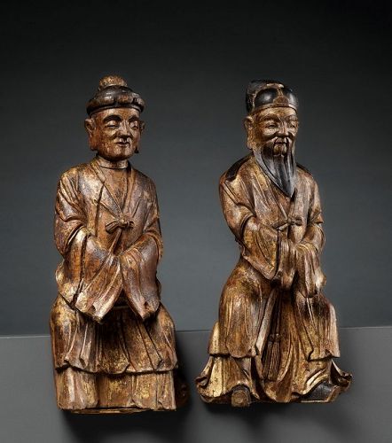 A PAIR OF GILT-LACQUERED HARDWOOD FIGURES OF IMMORTALS 一對鎏金漆木雕土地公婆